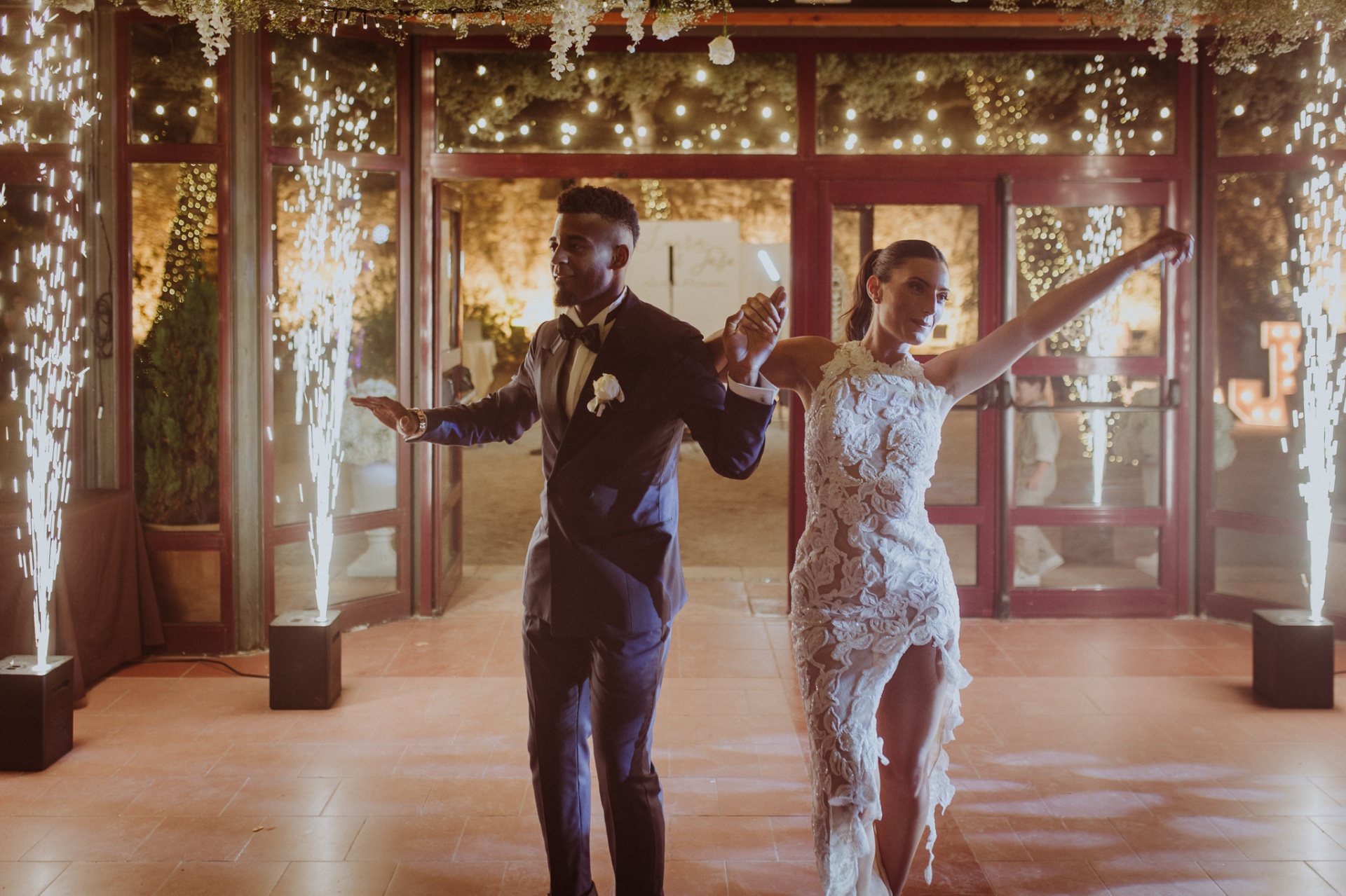 Laura in second Celebrity Sposa dress and Jose making grand entrance with cold spark fountains