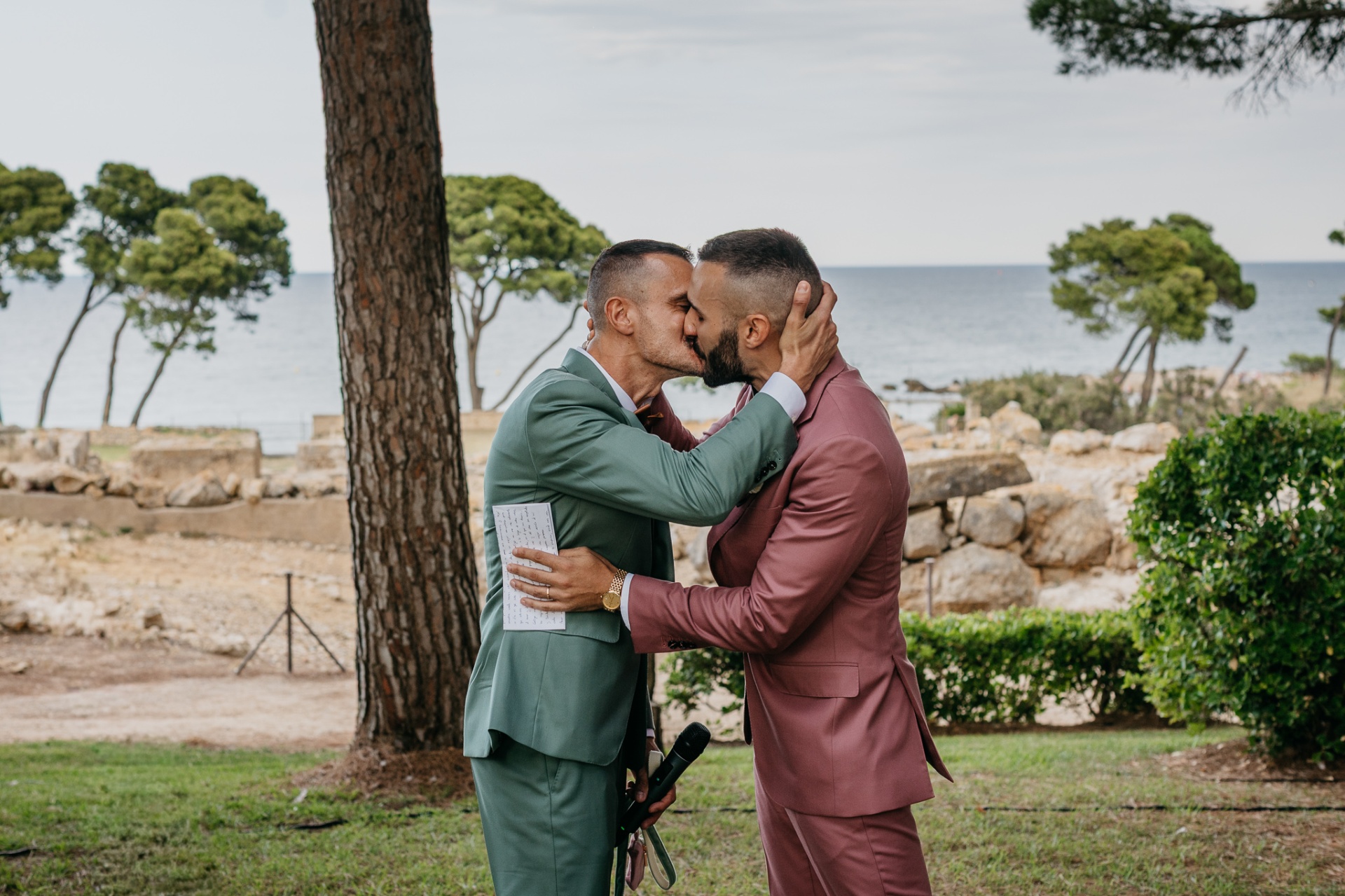 First kiss at the wedding ceremony by the Mediterranean