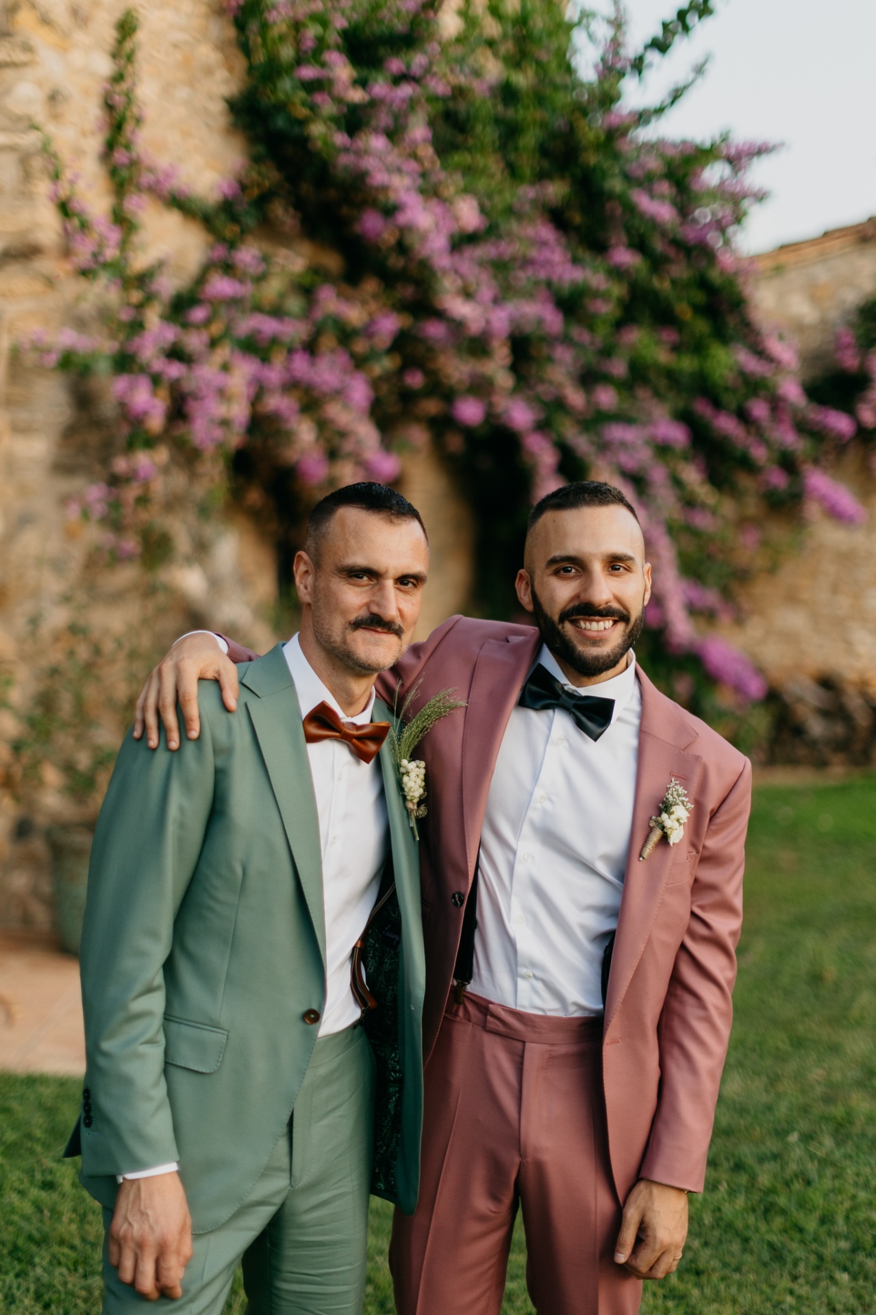 Grooms portrait with bougainvillea at Mas Terrats
