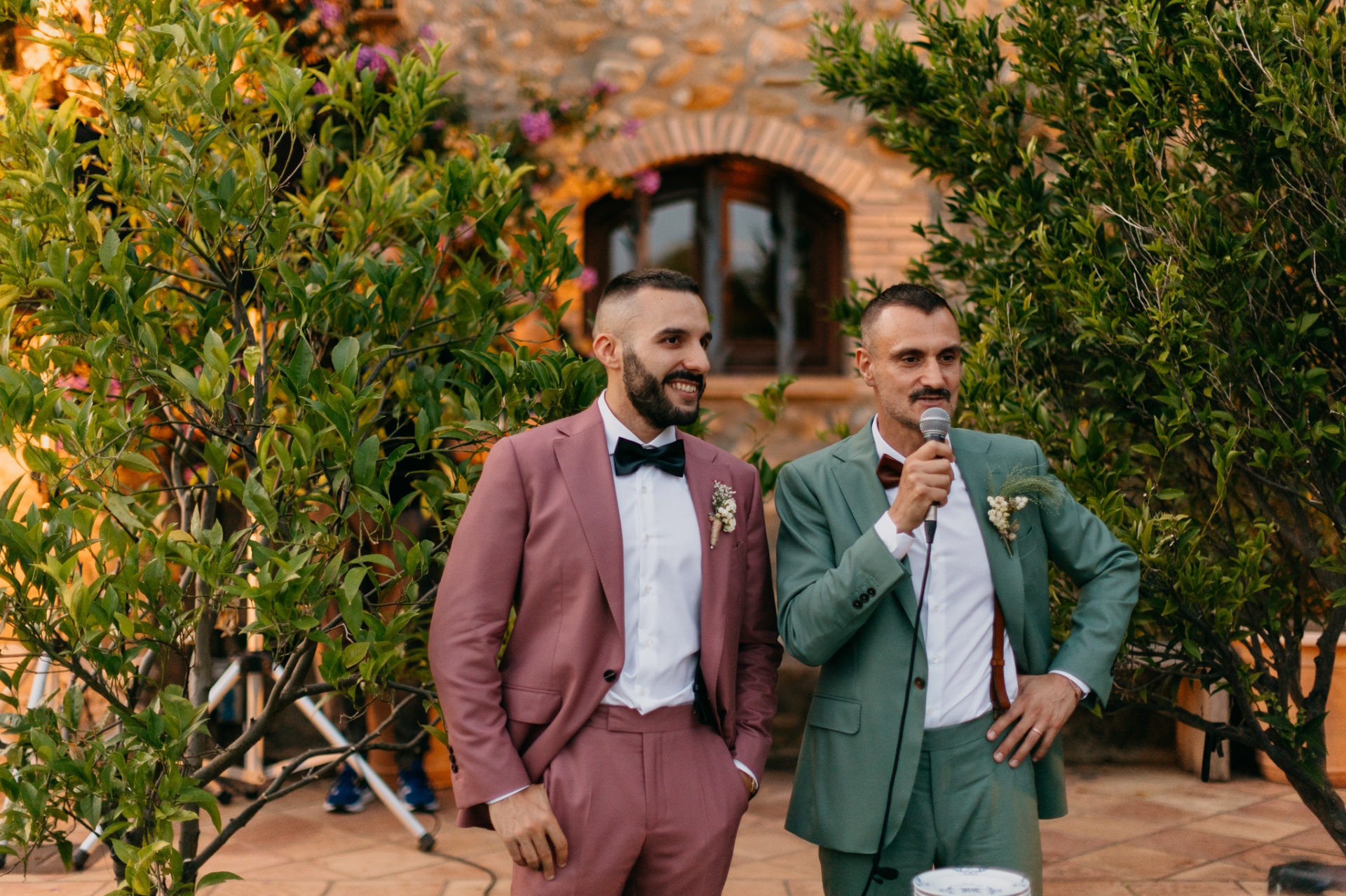 Robert and Edgar giving a speech at their wedding
